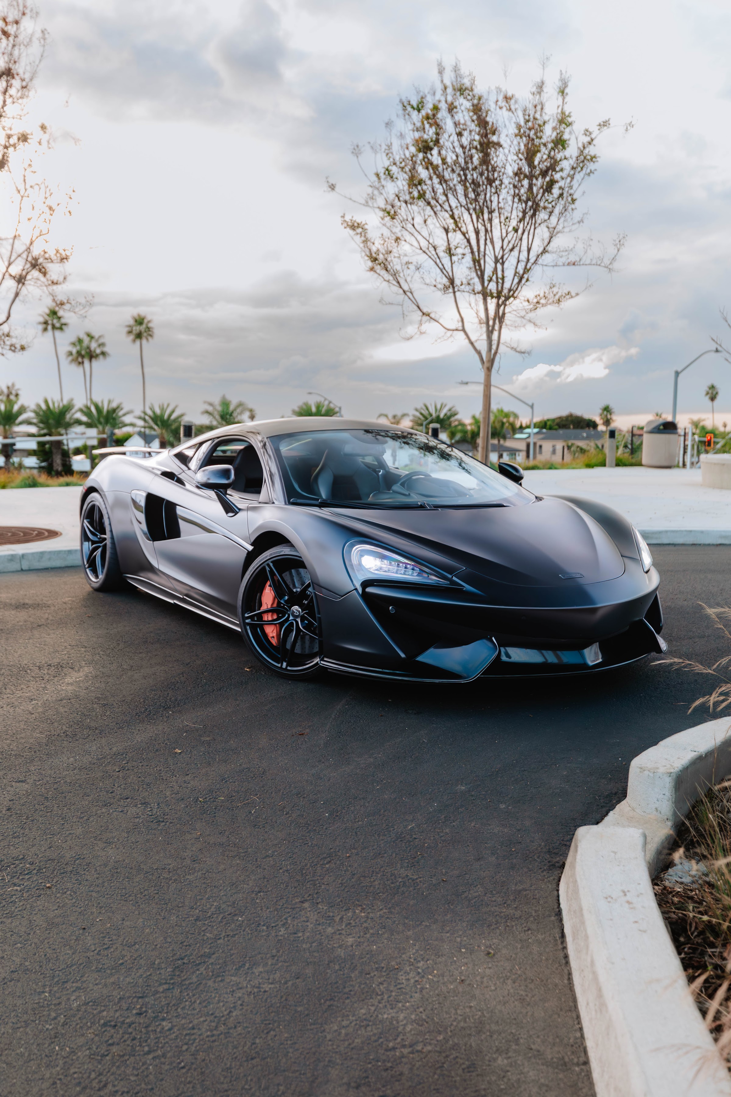 McLaren 570S satin black rental Orange County exotic car rental First Class Exotics