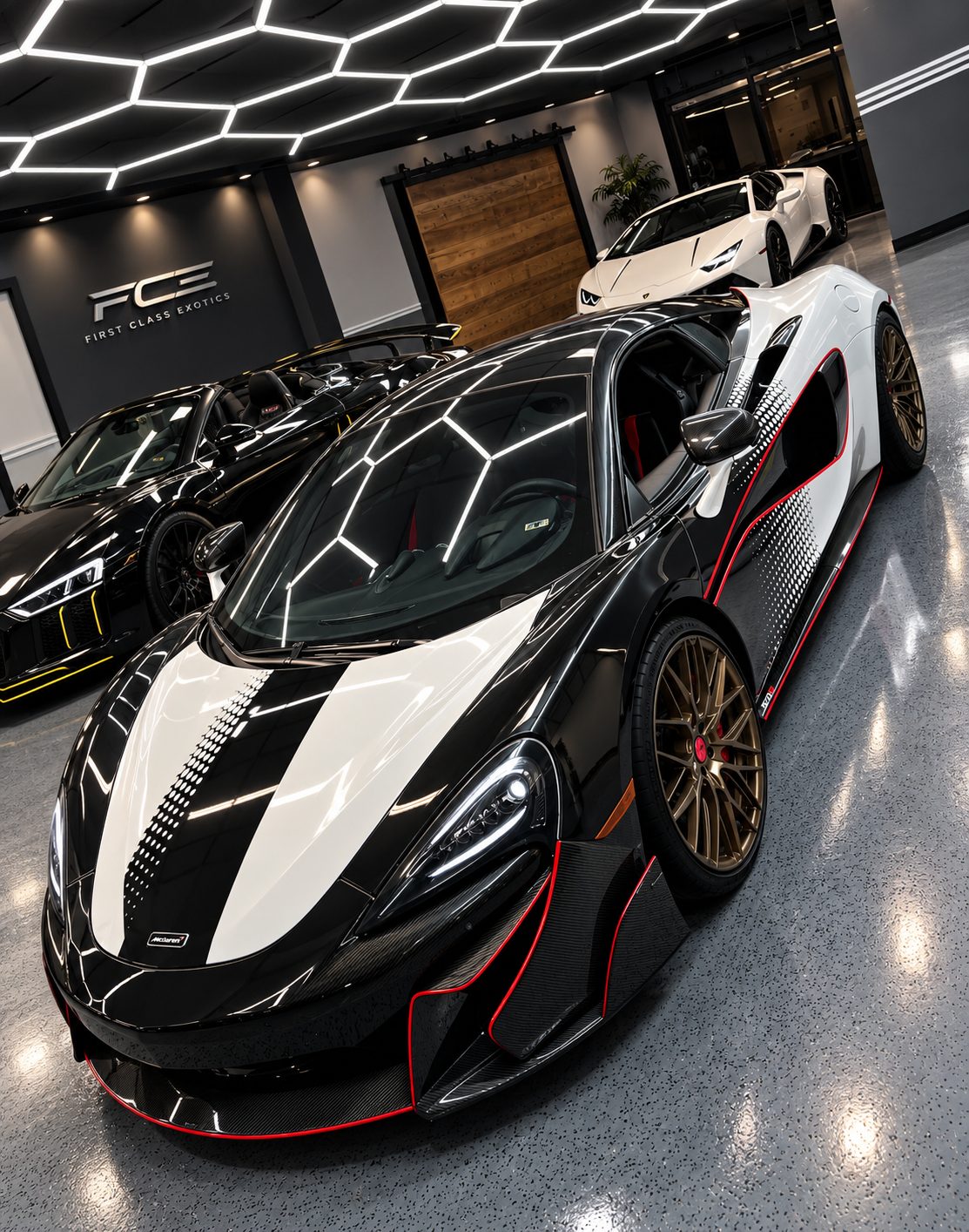 McLaren 570S after a custom black and white livery wrap with red pinstripe accents, installed at our Costa Mesa shop