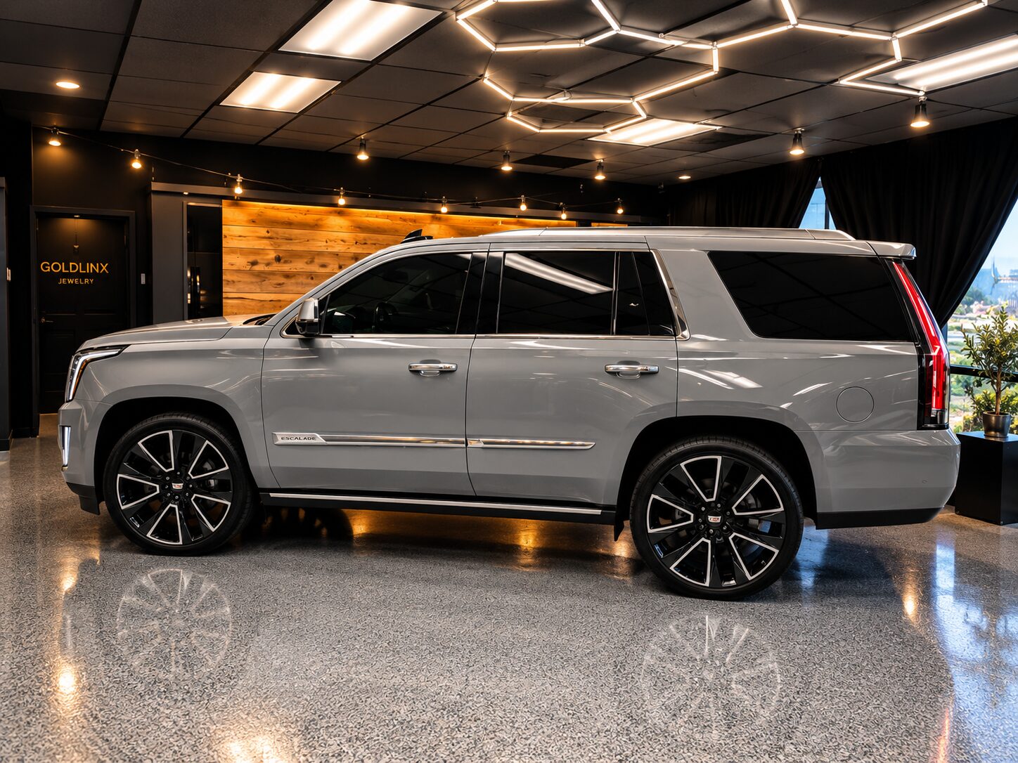 Cadillac Escalade after a full gloss Nardo Gray vinyl wrap, in our Costa Mesa showroom