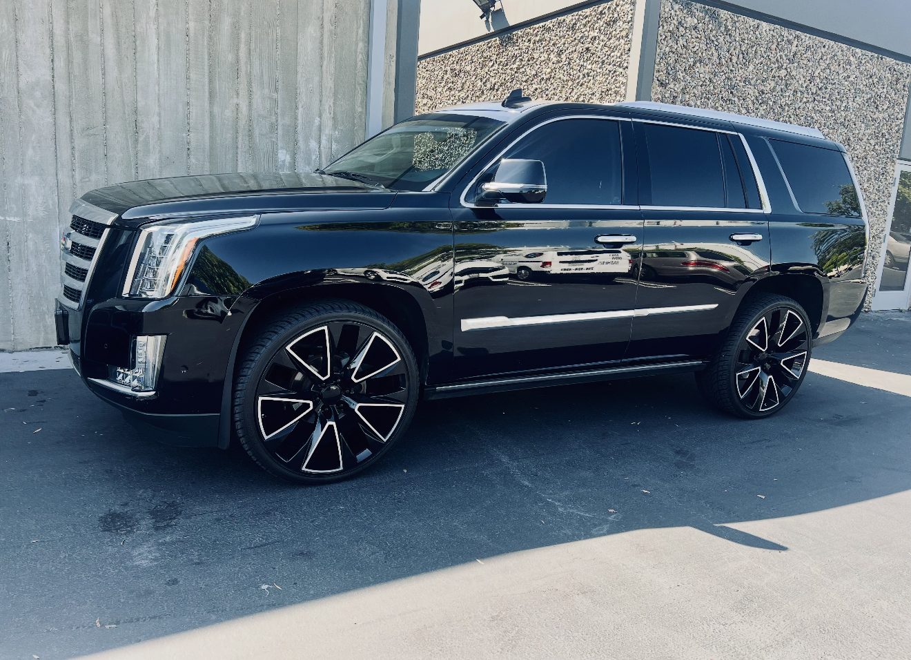 Gloss black Cadillac Escalade before its Nardo Gray vinyl wrap