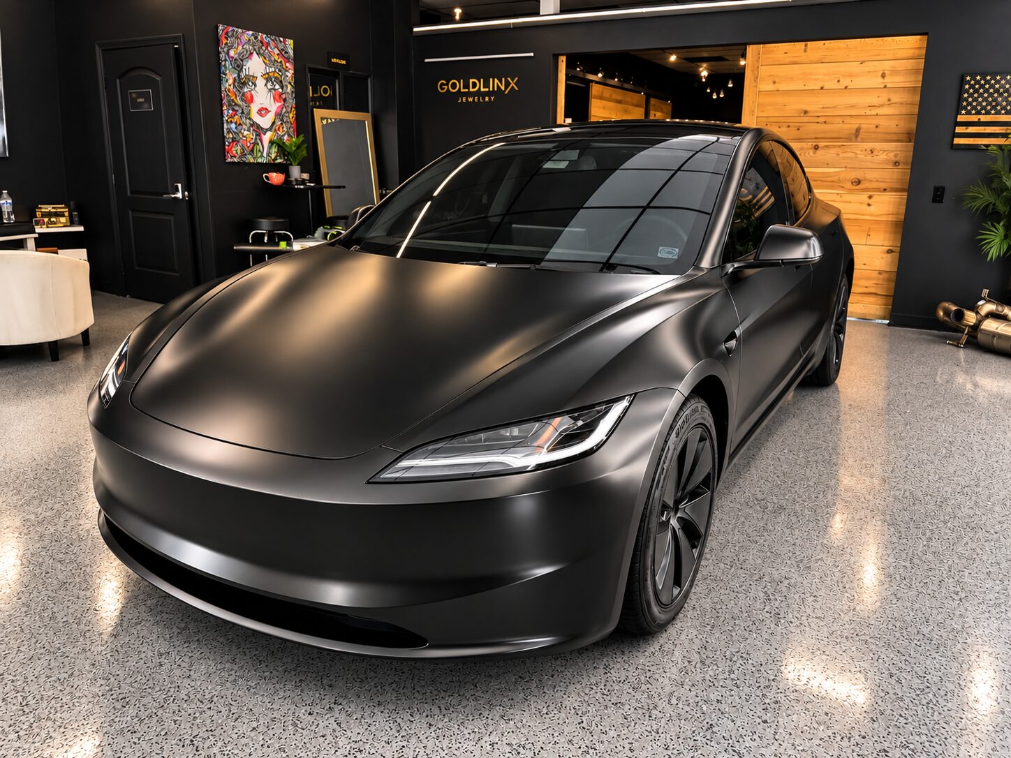 Tesla Model 3 after a full satin black vinyl wrap, finished in our Costa Mesa showroom